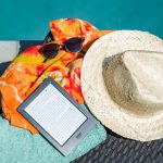 Black Amazon Kindle Tablet Near Brown Drawstring Sun Hat